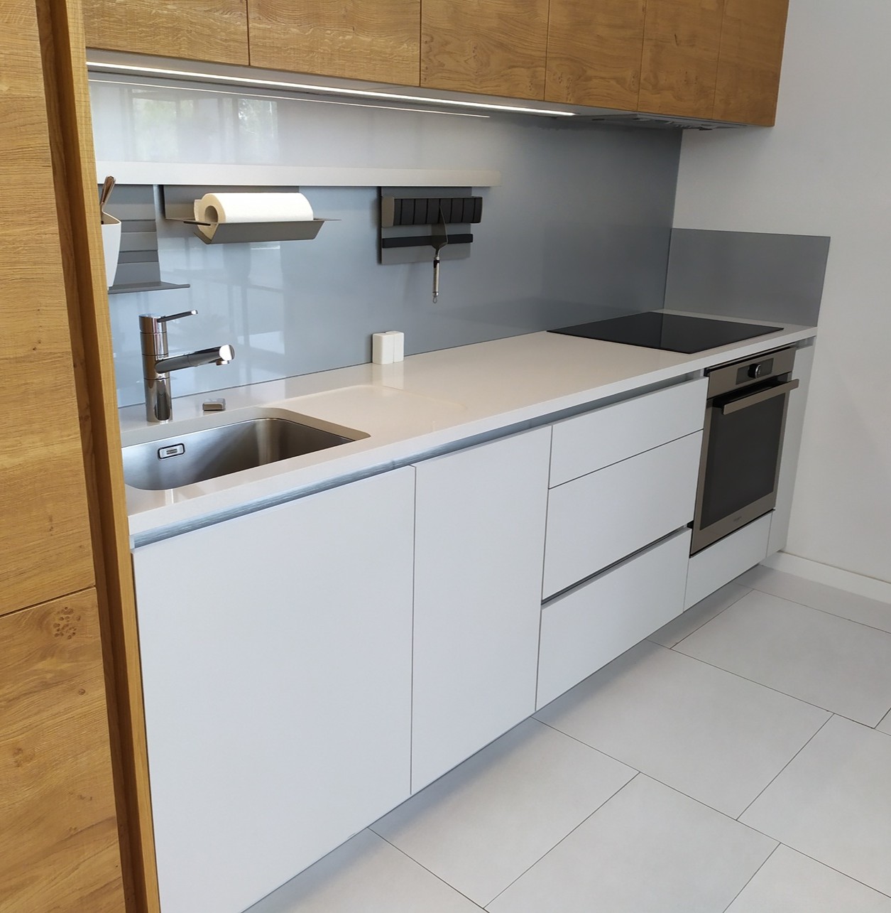Bright TechniStone Crystal Diamond engineered quartz kitchen countertop with polished finish, subtle shimmer on a clean white and grey surface.