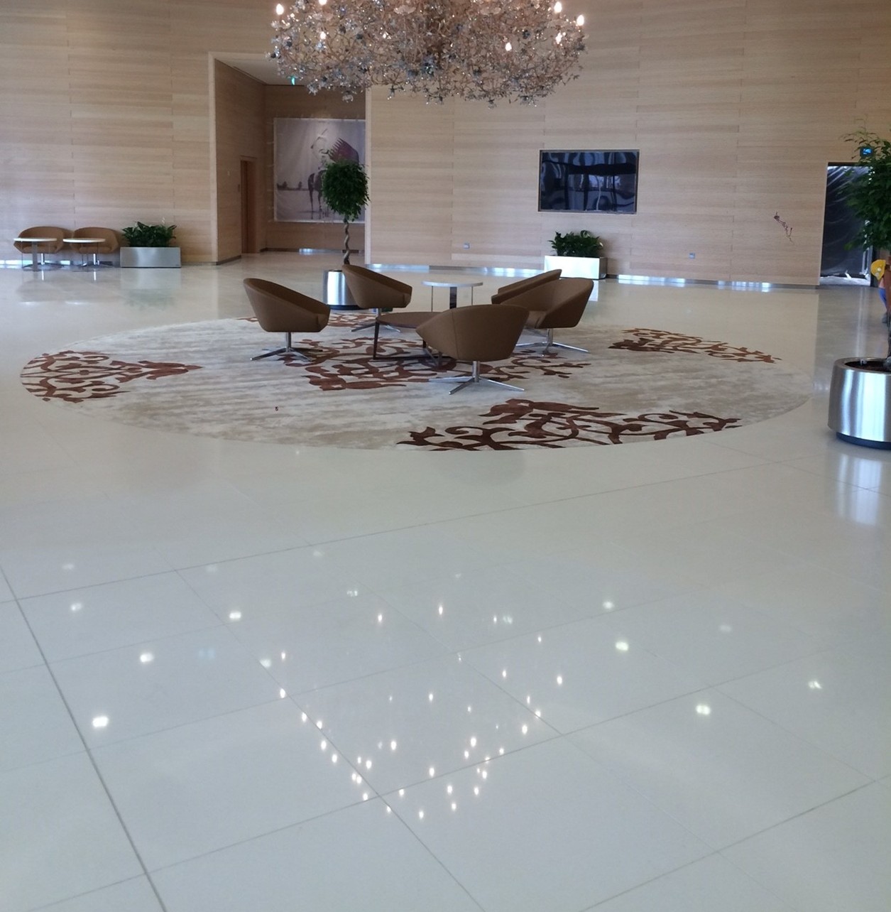Technistone Crystal Diamond with a light base and fine sparkling particles, finished in polished glossy quartz for an elegant shimmer indoors