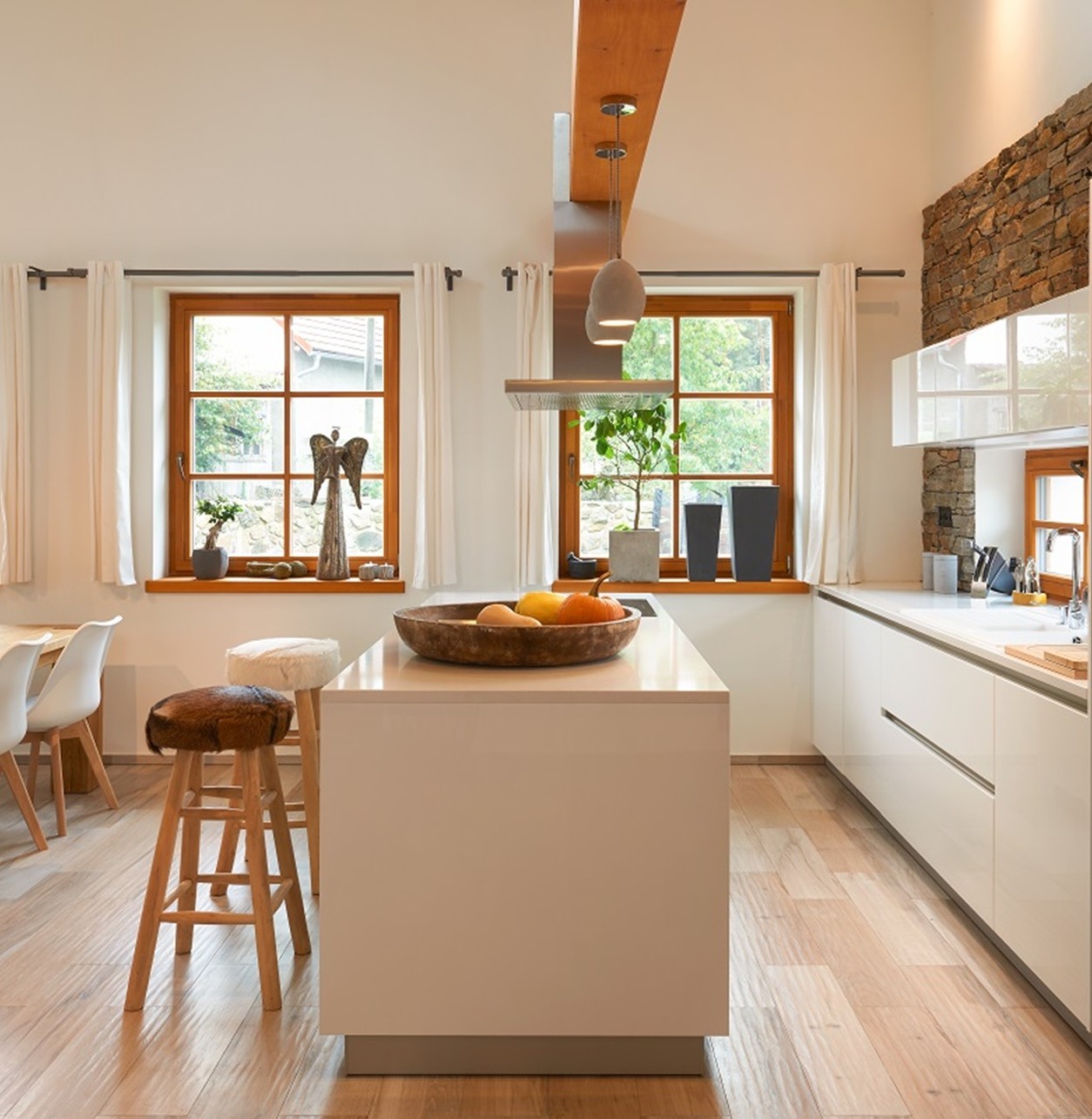 A bright kitchen counter in Technistone Crystal Diamond with a light base and polished finish, showing fine sparkling particles and subtle shimmer.