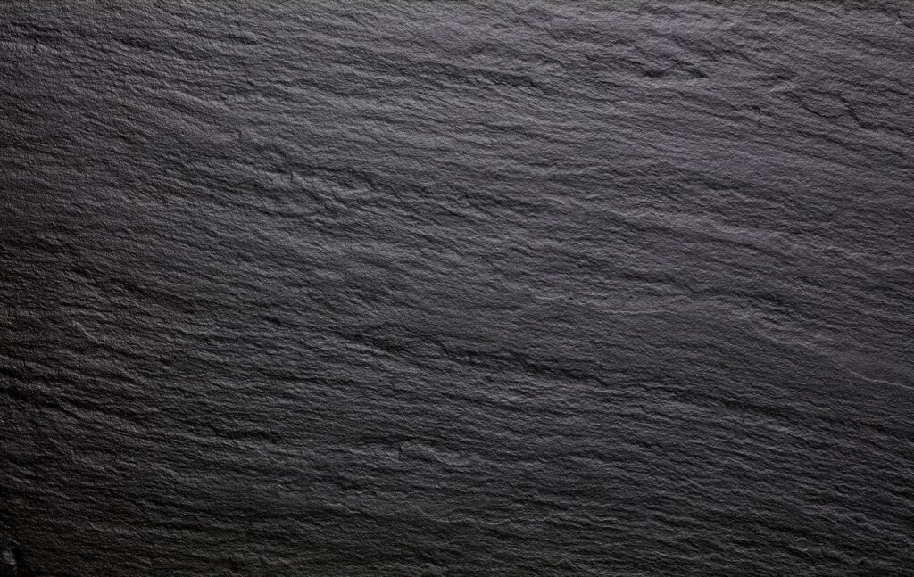 Close-up of Laminam Ardesia Nero textured surface.