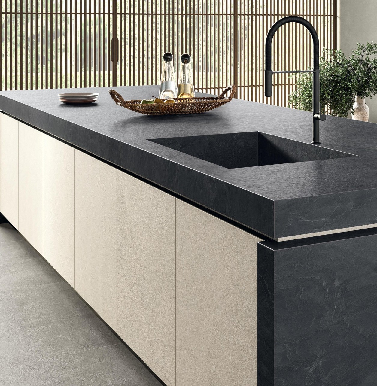 Laminam Vulcano surface on a dark textured stone-effect kitchen countertop with sink, brass-gold accents, and volcanic shadow tones.