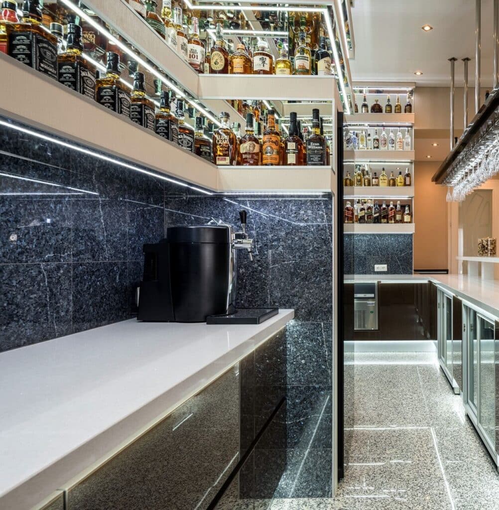Bright white Technistone Brilliant White countertop with polished, mirror-like structure and subtle sparkle in a modern kitchen interior