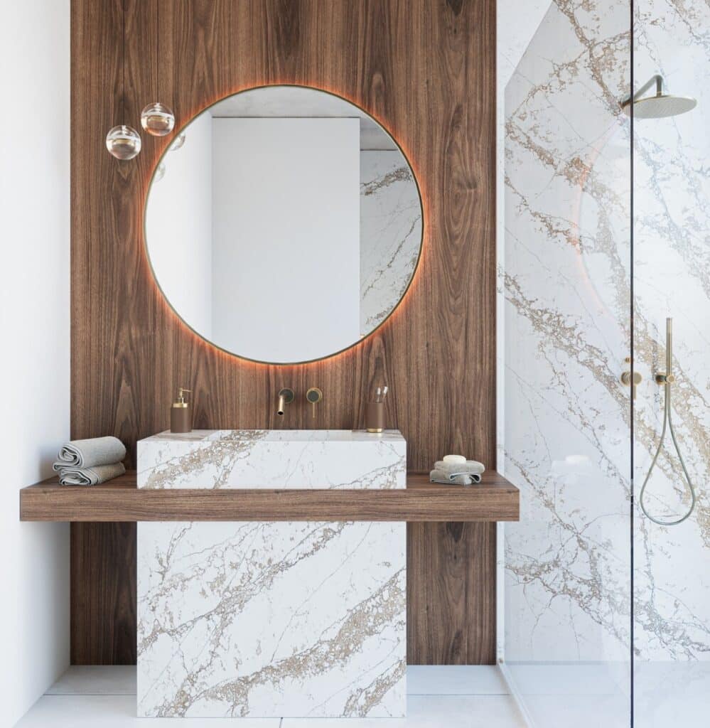 TechniStone Bronze Coast quartz vanity top with a light marble-inspired base and copper-bronze veining, polished gloss on a bathroom setup.