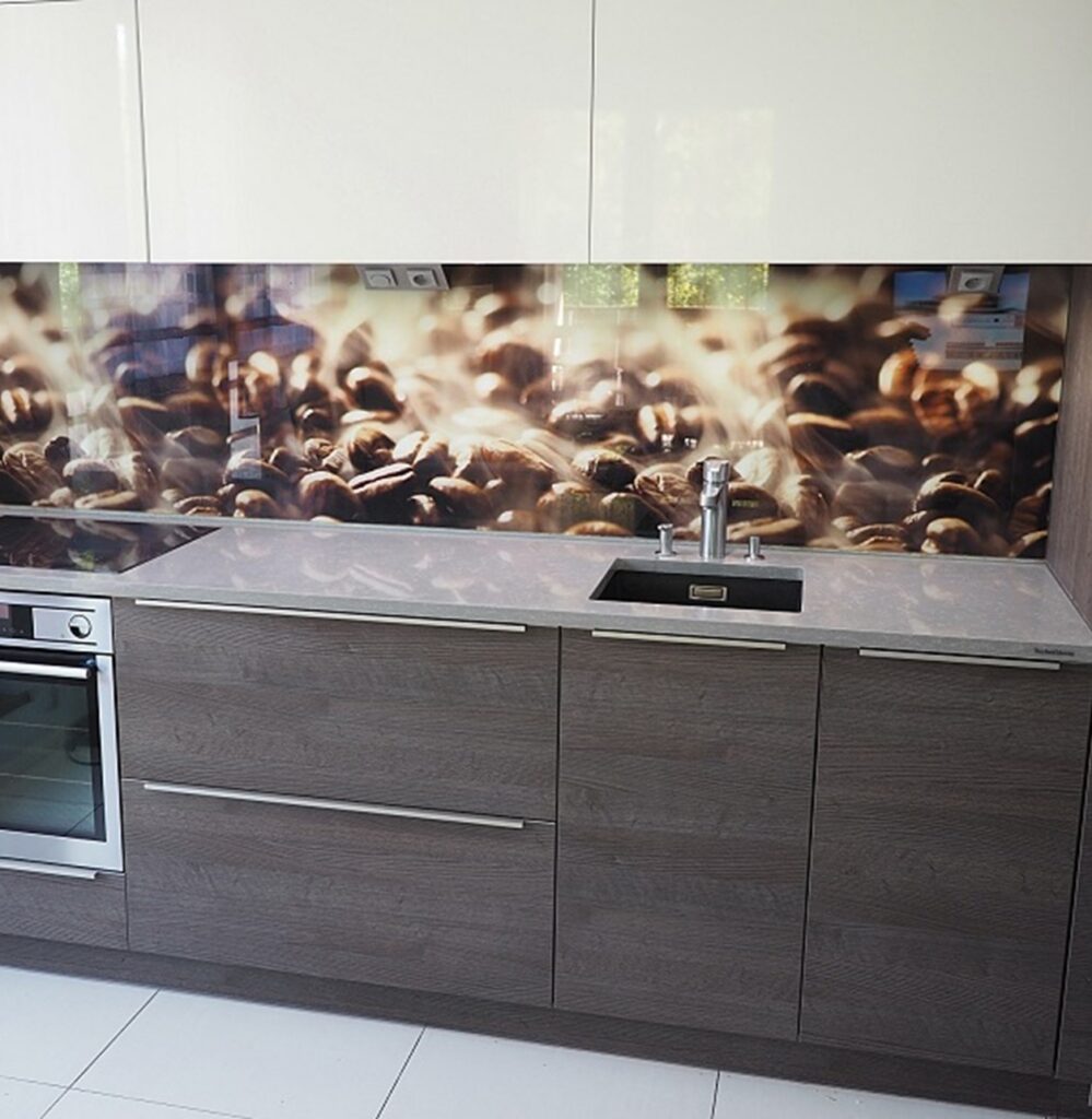 TechniStone Noble Pro Cloud quartz kitchen countertop with soft grey surface and elegant white veining, paired with dark cabinetry and a reflective sink