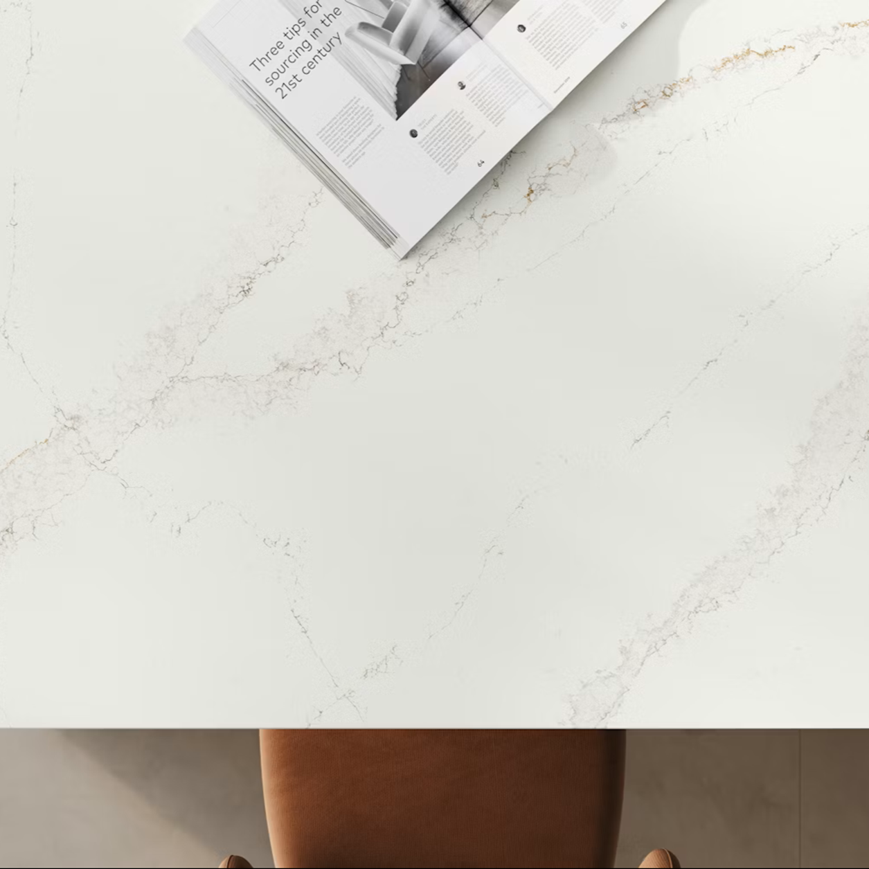 Silestone Bronze Rivers countertop with a magazine open to an article about sourcing in the 21st century.