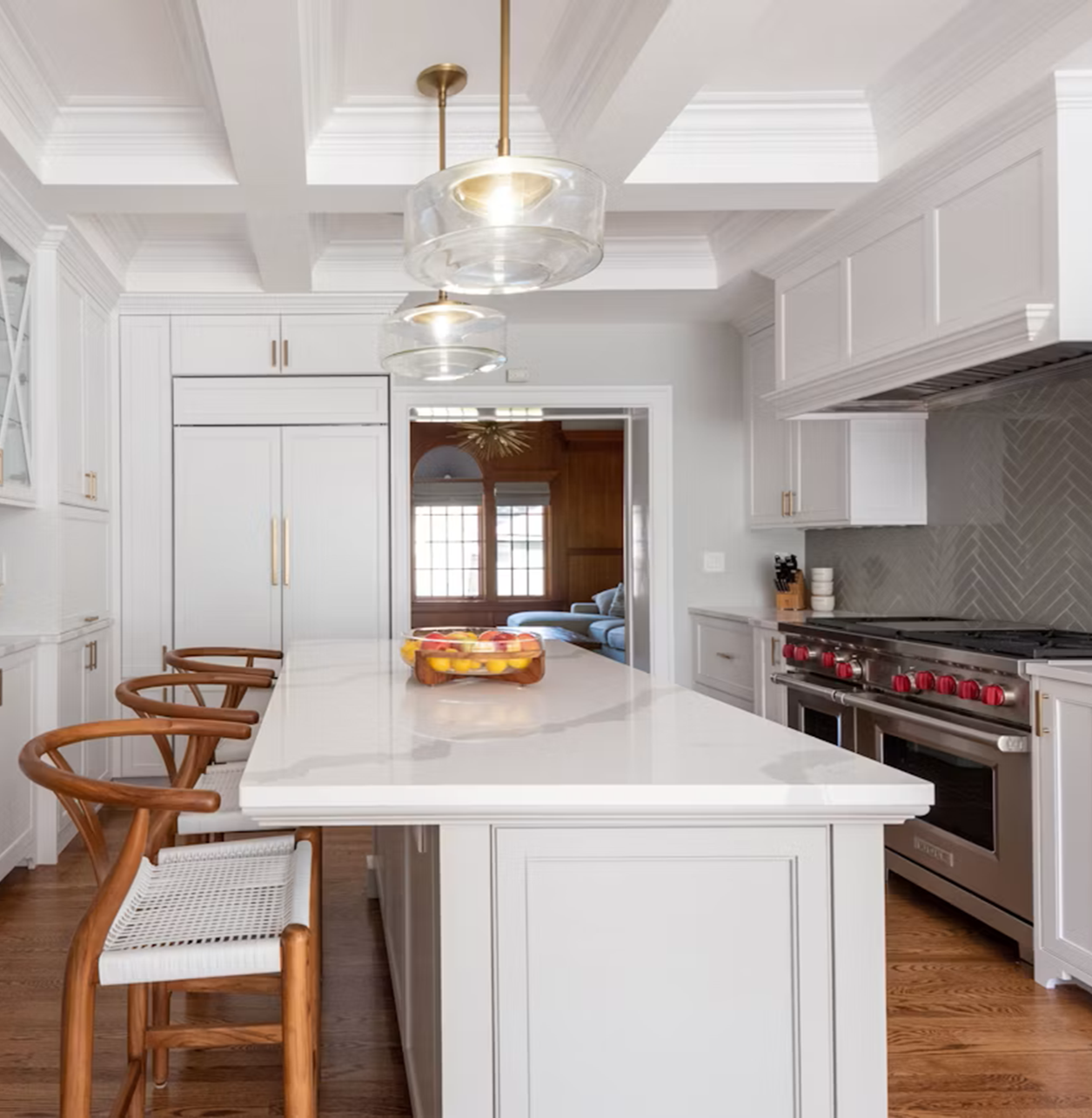 Silestone Bianco Calacatta quartz island in a bright white kitchen, with soft grey veining, polished finish and elegant marble-inspired character.