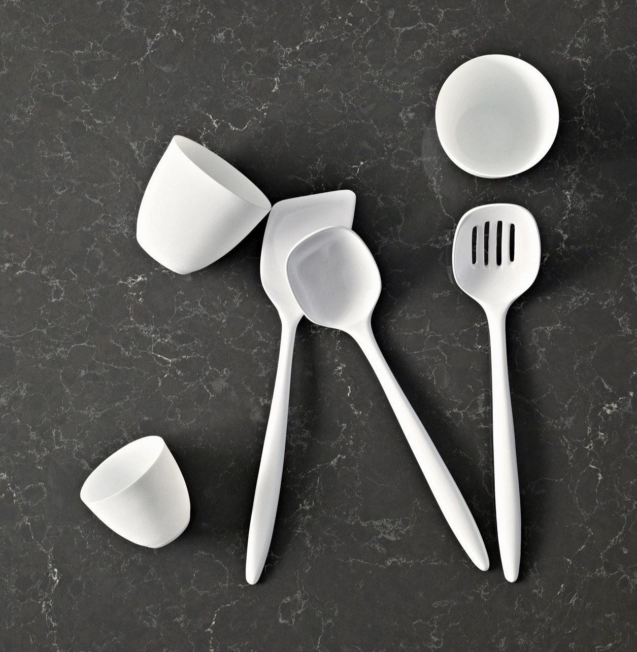 White Caesarstone Piatra Grey kitchen utensils on marble countertop