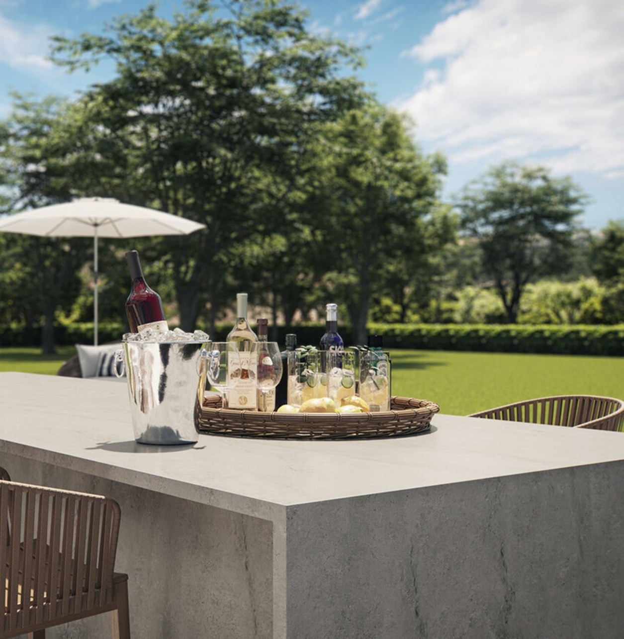 Caesarstone 540 Monumental porcelain shows an ivory grey surface with subtle veining and a rough honed finish on an outdoor dining table.