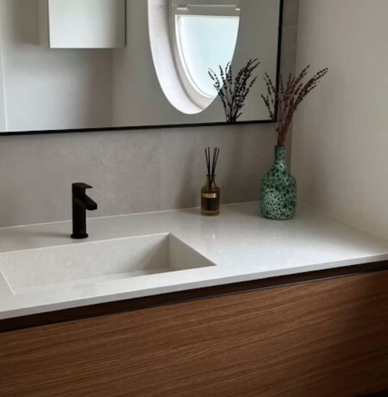 Silestone Yukon countertop with integrated sink, modern faucet, and decorative accents