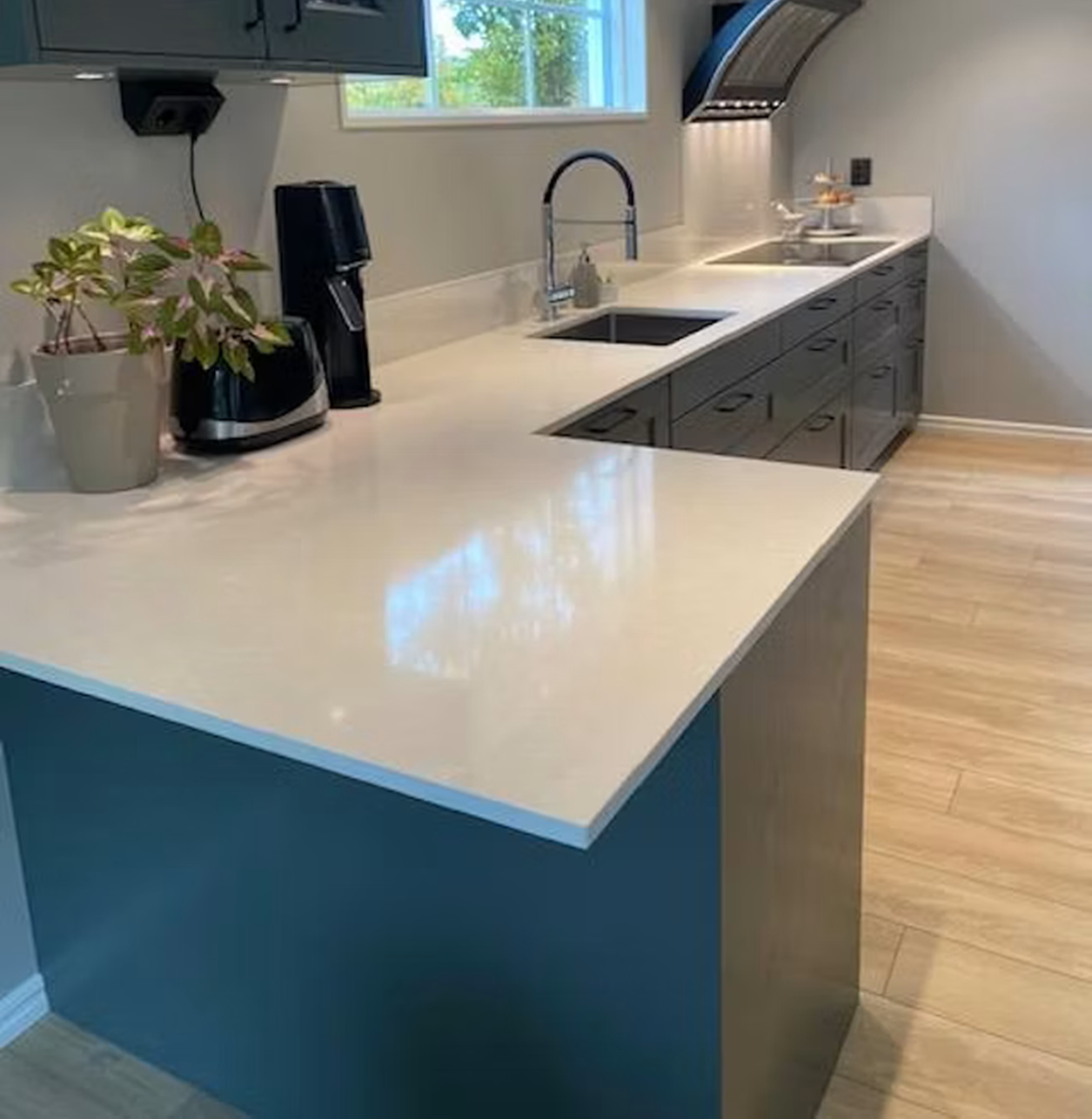 Silestone Yukon countertop with a modern kitchen island and sink.