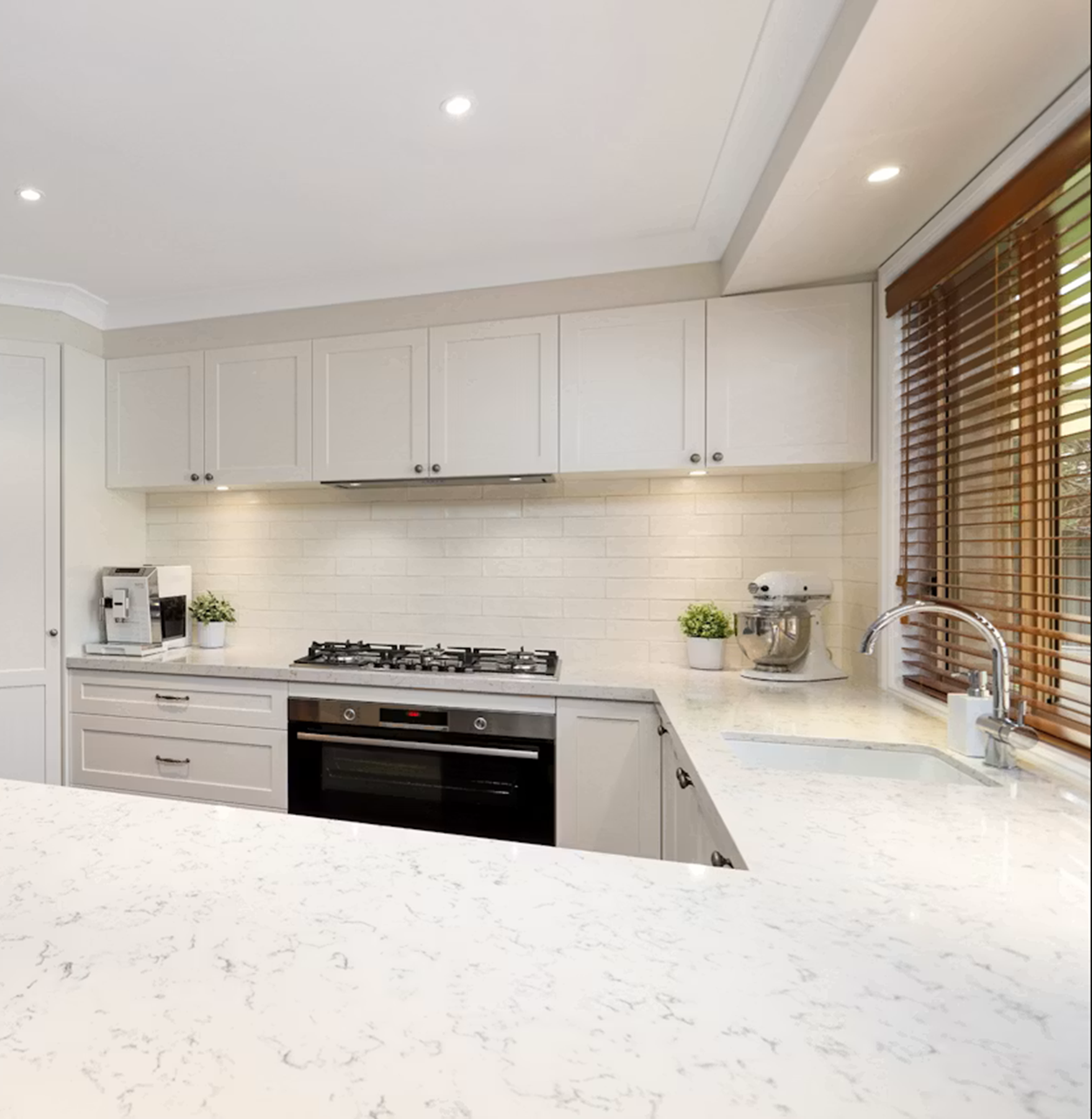 Modern kitchen with Silestone Lyra countertops and white cabinets