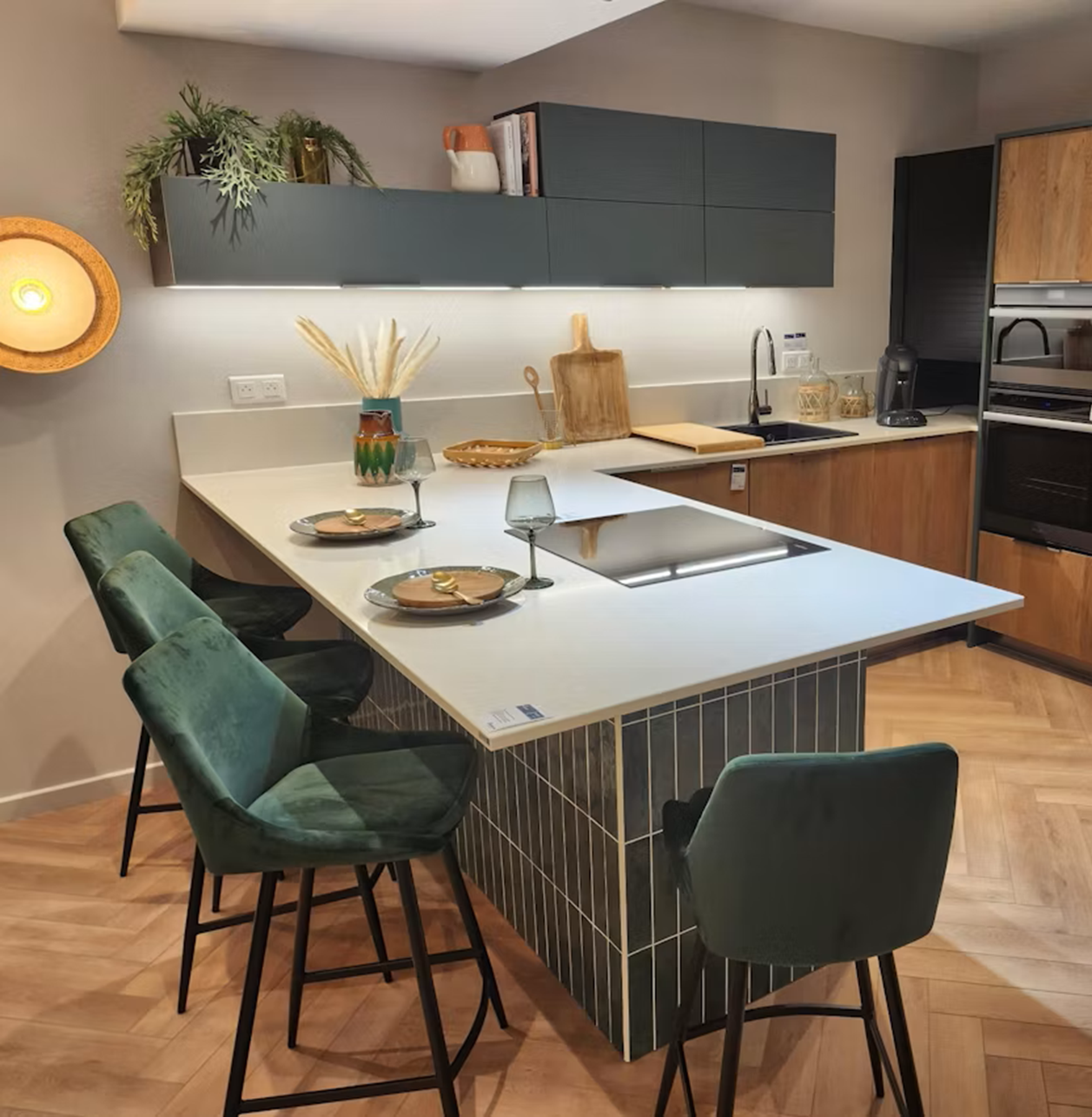 Silestone Yukon countertop in a modern kitchen with green bar stools.
