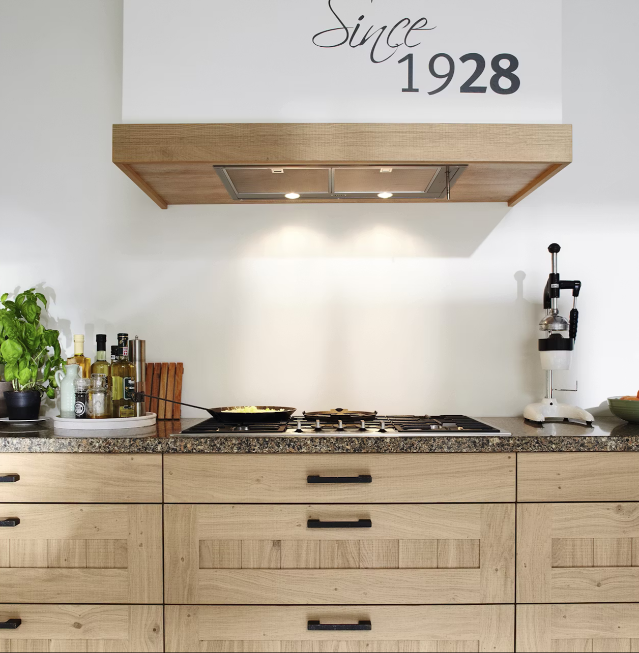 Modern kitchen with Silestone Sienna Ridge countertop, gas stove, and wooden cabinets