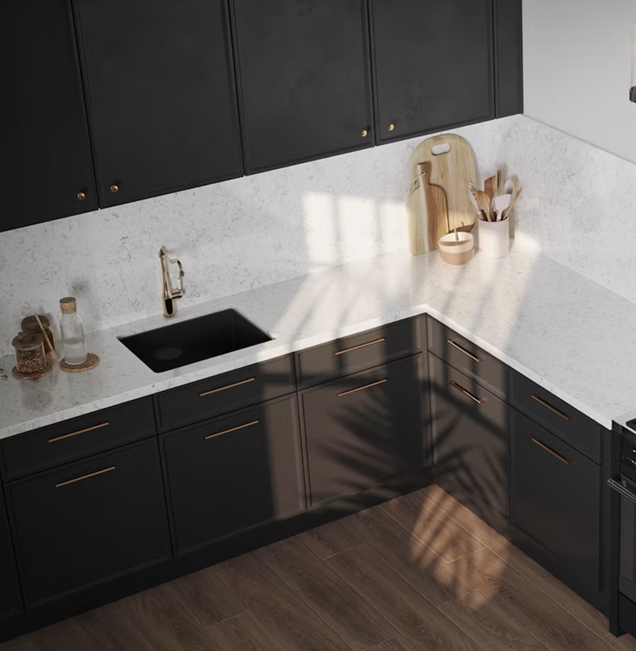 Modern black kitchen with Silestone Lyra countertops and a gold faucet.