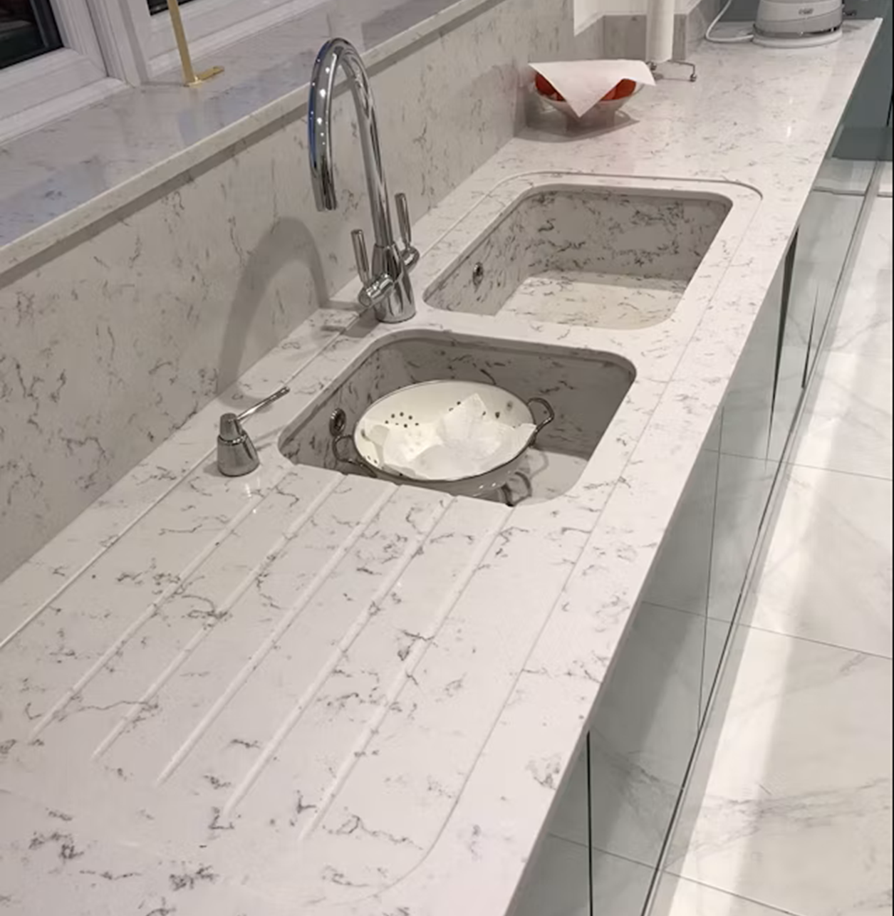Silestone Lyra countertop with integrated sink and chrome faucet.