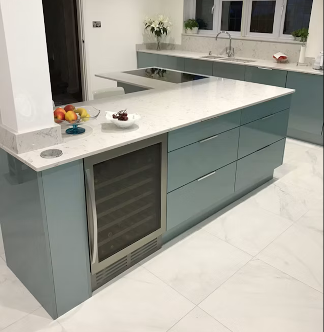 Modern kitchen island with Silestone Lyra countertop and integrated wine fridge