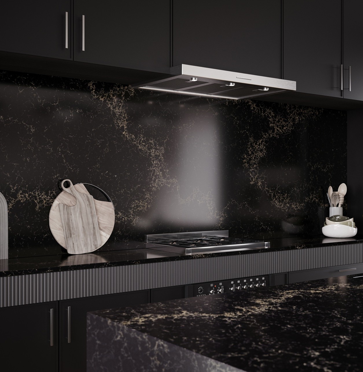 Modern black kitchen with marble countertops and stainless steel gas stove.