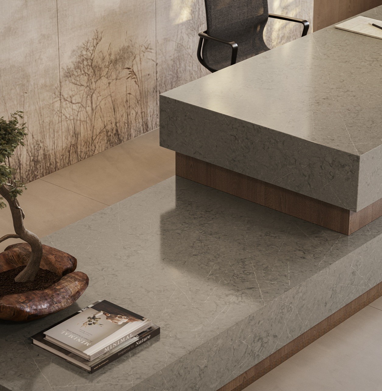 Caesarstone 5133 Symphony Grey countertop in a modern office with a bonsai tree and books.