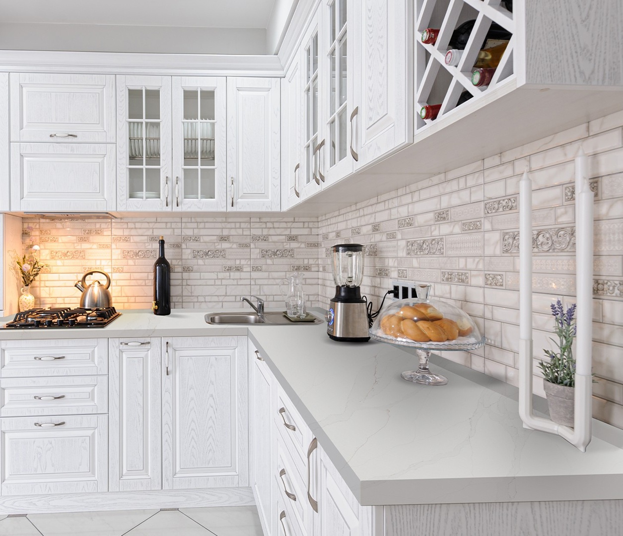 A bright white kitchen with Avant Quartz Calacatta Cannes Gold worktops, subtle grey veining, and warm golden accents.