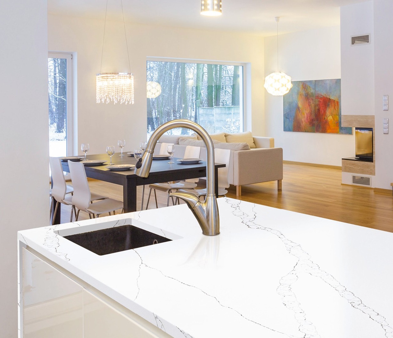Avant Quartz 7000 Calacatta Eno countertop with sink in a modern kitchen with dining area.
