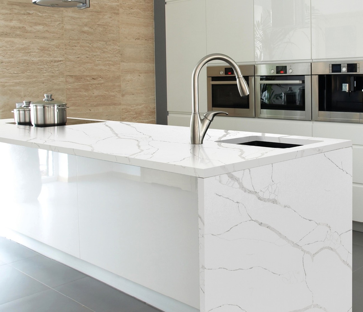 Avant Quartz 7400 Calacatta Dauphine countertop with a modern kitchen island and sink