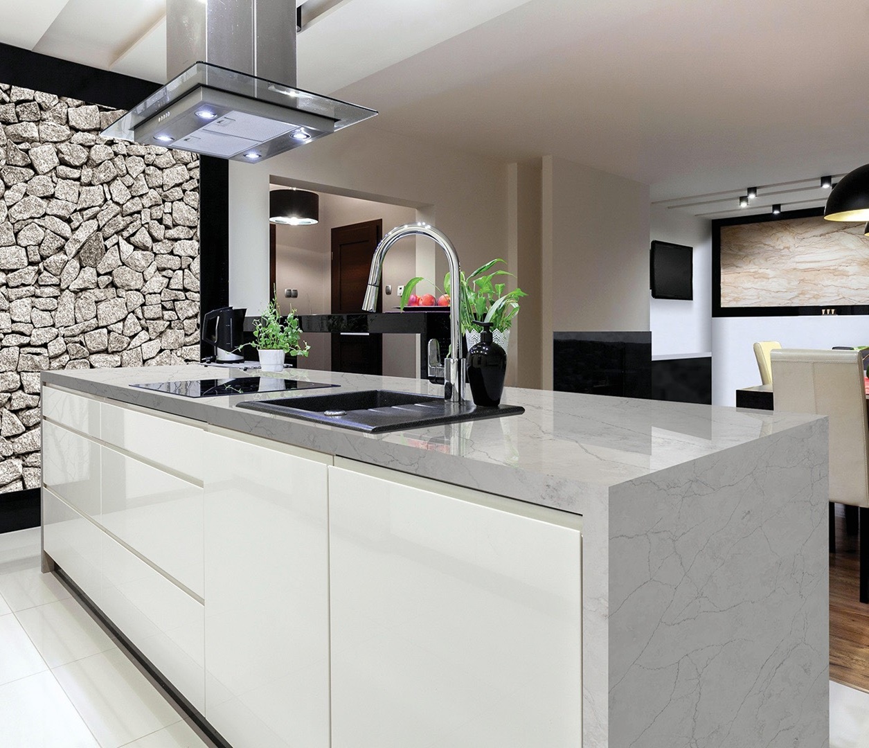 Avant Quartz 7540 Calacatta Concorde kitchen island with modern sink and faucet.