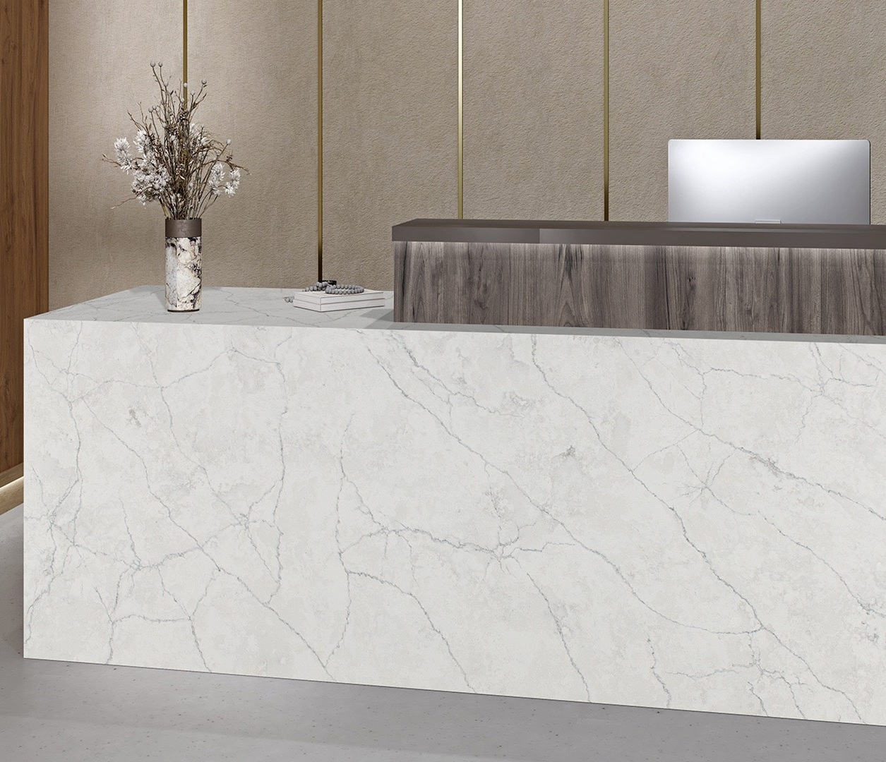 Avant Quartz 7540 Calacatta Concorde countertop at a reception desk with floral arrangement.