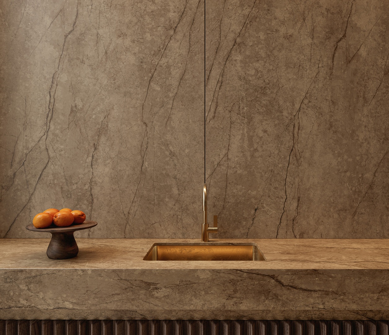 Modern kitchen with stone countertop, brass faucet, and fruit bowl