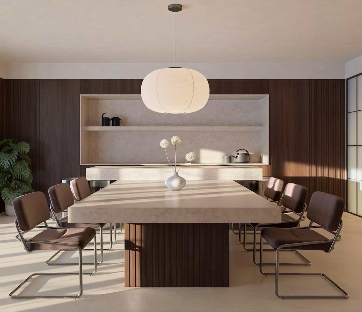 Modern dining room with Eclos Veilr table, minimalist chairs, and large pendant light.